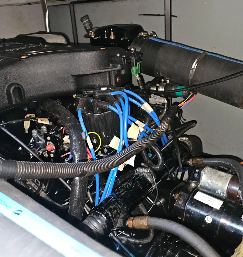 Slide: The Image of Engine compartment of a 2000 Silverton 392 Motor Yacht with visible wiring and components. - 37