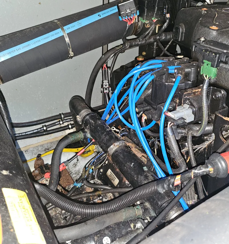 Slide: The Image of Engine compartment of a 2000 Silverton 392 Motor Yacht with visible wiring and components. - 39