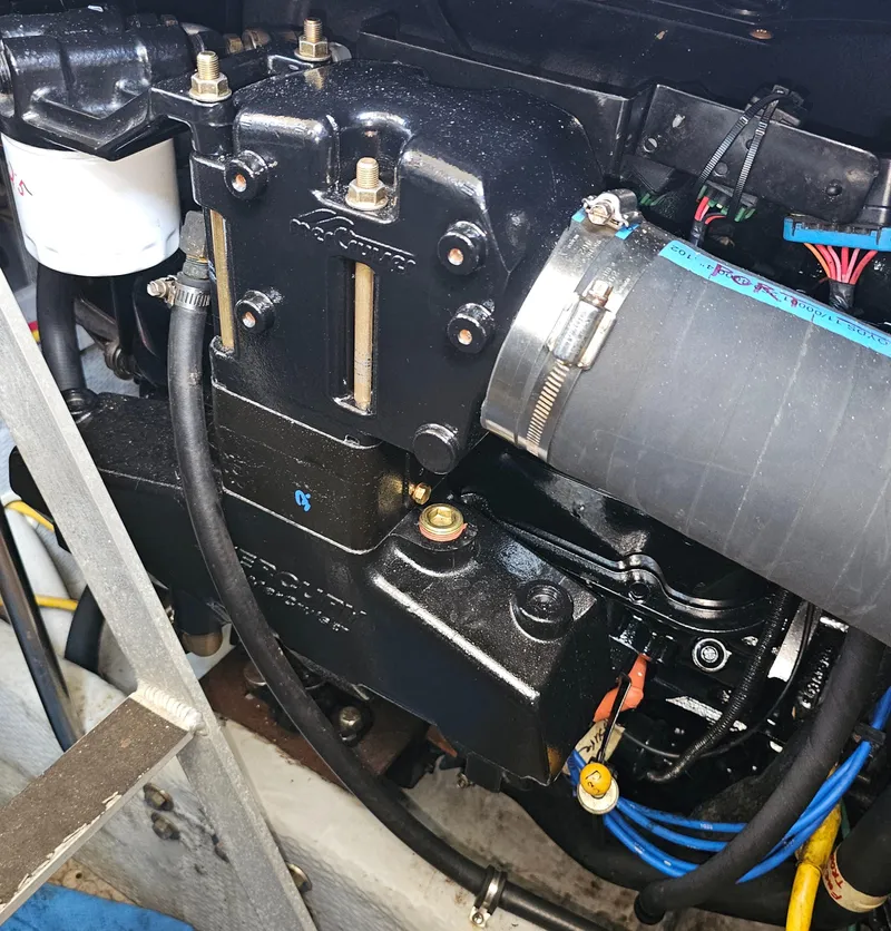 Slide: The Image of Engine compartment of a 2000 Silverton 392 Motor Yacht, showcasing detailed mechanical components. - 40