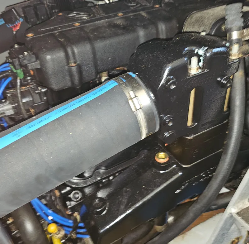 Slide: The Image of Engine compartment of a 2000 Silverton 392 Motor Yacht, featuring hoses and components. - 41