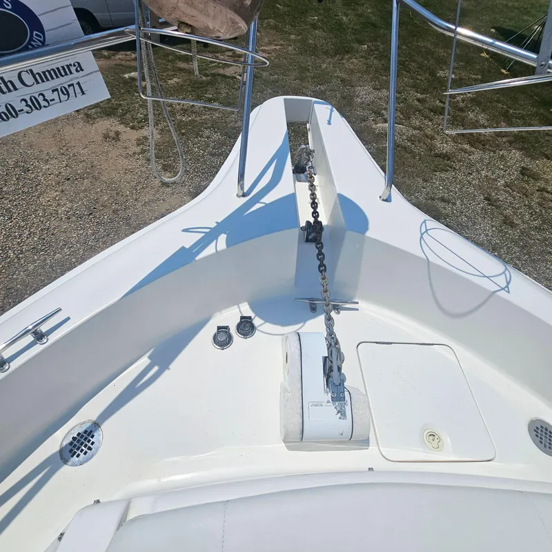 Slide: The Image of Bow of 2000 Silverton 392 Motor Yacht with anchor chain and deck fittings. - 6