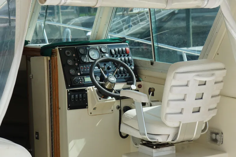 Slide: The Image of Interior helm of 1996 Albin 28TE boat with steering wheel and control panel. - 4