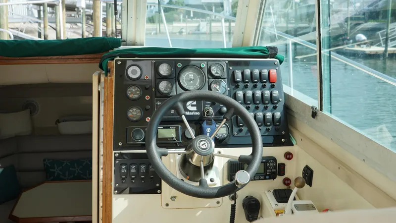 Slide: The Image of 1996 Albin 28TE boat cockpit with steering wheel and control panel. - 6