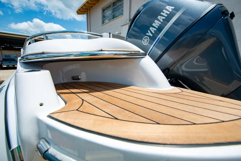 Slide: The Image of 2006 Novurania RHIB with Yamaha engine, featuring sleek wooden deck and modern design. - 16