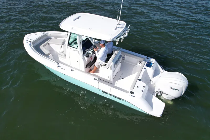 Slide: The Image of 2022 Everglades 235 Center Console boat on water, featuring Yamaha outboard engine. - 10