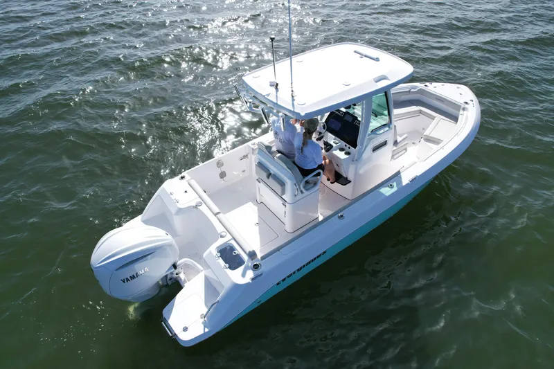 Slide: The Image of 2022 Everglades 235 Center Console boat on water, aerial view. - 11