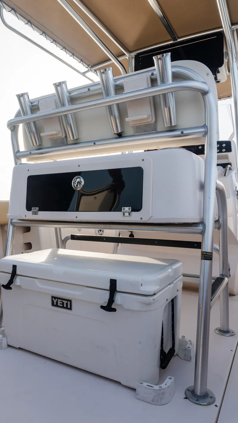 Slide: The Image of Grady-White 273 Chase CC 2025 boat interior with Yeti cooler and rod holders. - 14