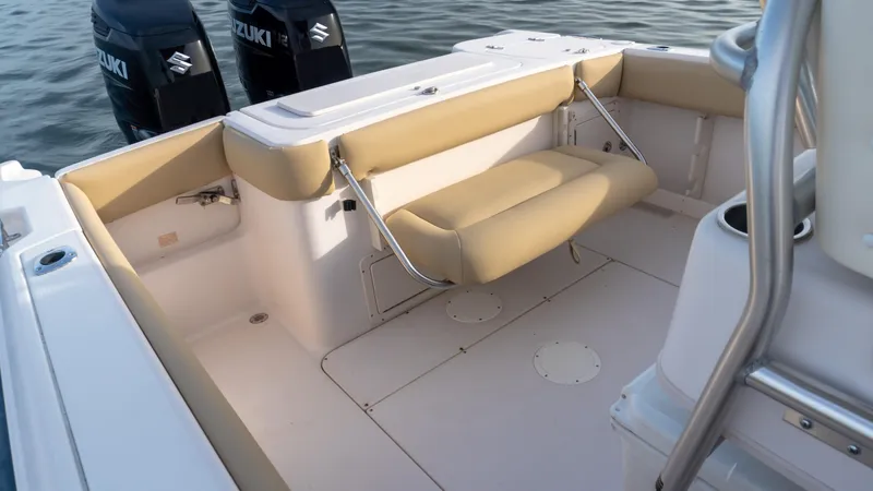 Slide: The Image of Grady-White 273 Chase CC 2025 boat interior with seating and dual Suzuki engines. - 17
