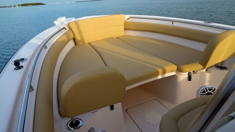 Slide: The Image of Grady-White 273 Chase CC 2025 boat with tan seating, ocean view. - 26