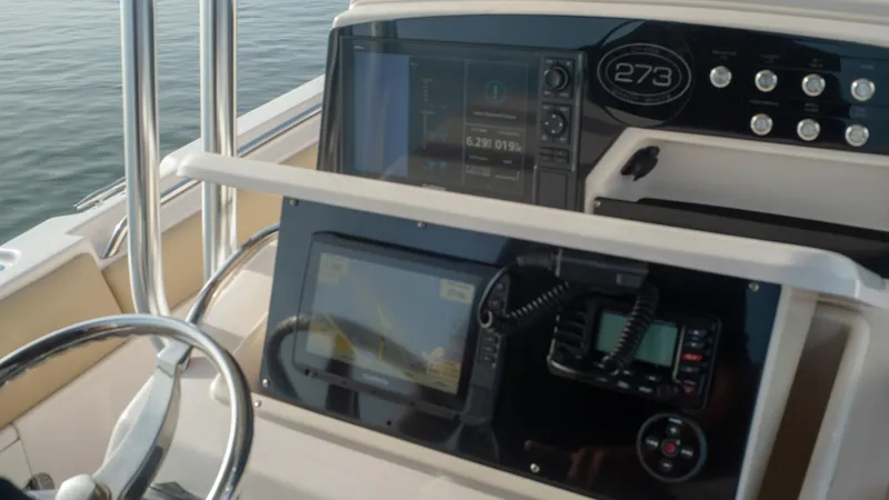 Slide: The Image of Grady-White 273 Chase CC 2025 dashboard with navigation and control systems. - 5