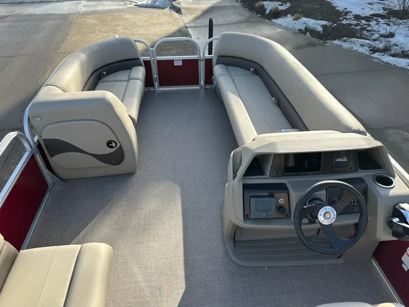 Slide: The Image of 2025 Sun Tracker Party Barge 18 DLX interior with spacious seating and steering console. - 5