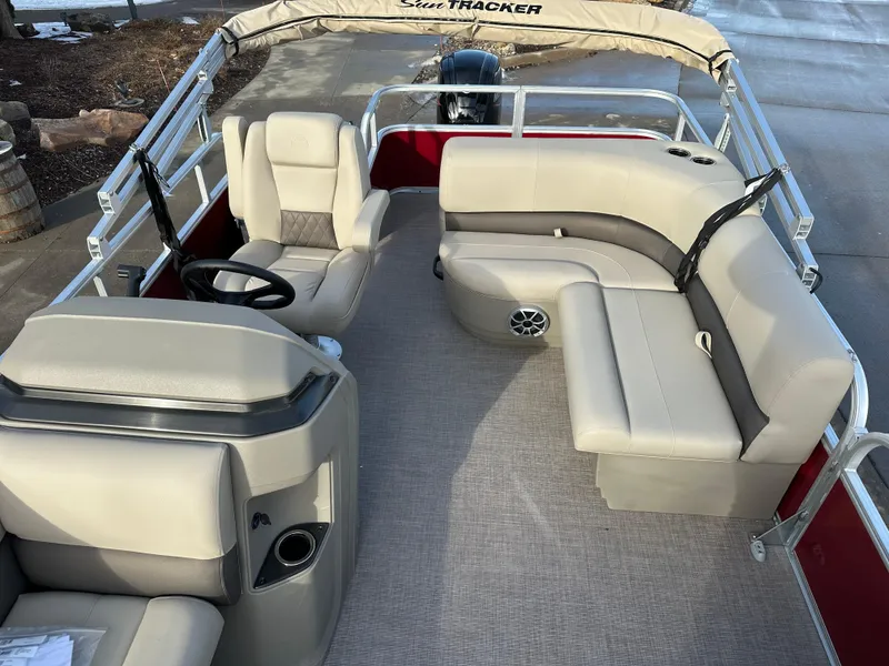 Slide: The Image of 2025 Sun Tracker Party Barge 18 DLX pontoon boat interior with seating and helm. - 7