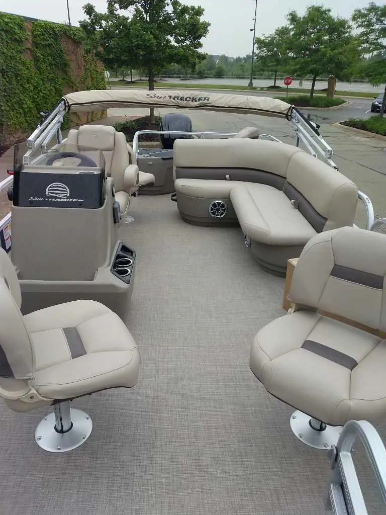 Slide: The Image of 2025 Sun Tracker Bass Buggy 18 DLX pontoon boat with spacious seating and modern design. - 3