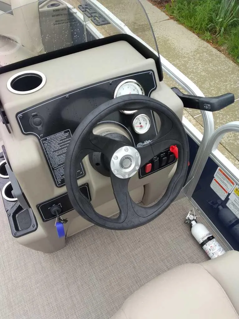 Slide: The Image of Steering console of 2025 Sun Tracker Bass Buggy 18 DLX pontoon boat. - 4