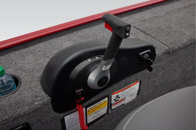 Slide: The Image of 2025 Tracker Panfish 17 boat storage compartment with open lid, showcasing interior details. - 16