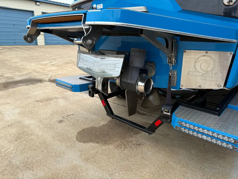 Slide: The Image of Rear view of a 2021 Malibu M240 boat with advanced wake system. - 14