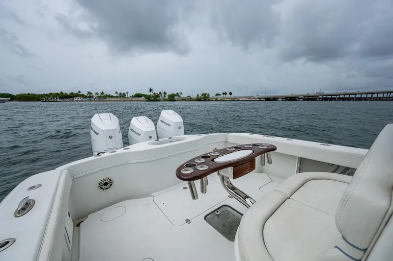 Slide: The Image of 2013 Yellowfin 39 Offshore boat with triple engines on a cloudy day. - 32