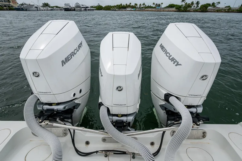 Slide: The Image of Triple Mercury outboard engines on a 2013 Yellowfin 39 Offshore boat. - 37