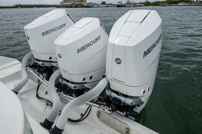 Slide: The Image of Triple Mercury outboard engines on a 2013 Yellowfin 39 Offshore boat. - 38