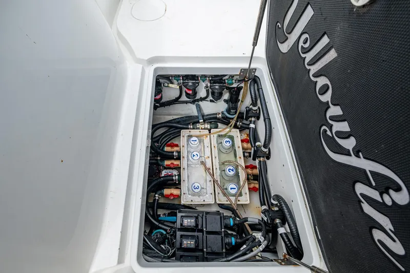 Slide: The Image of 2013 Yellowfin 39 Offshore boat electrical compartment with wiring and components. - 43