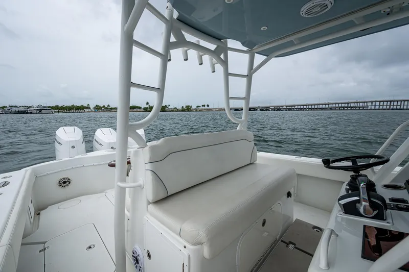 Slide: The Image of 2013 Yellowfin 39 Offshore boat interior with seating and ocean view. - 48