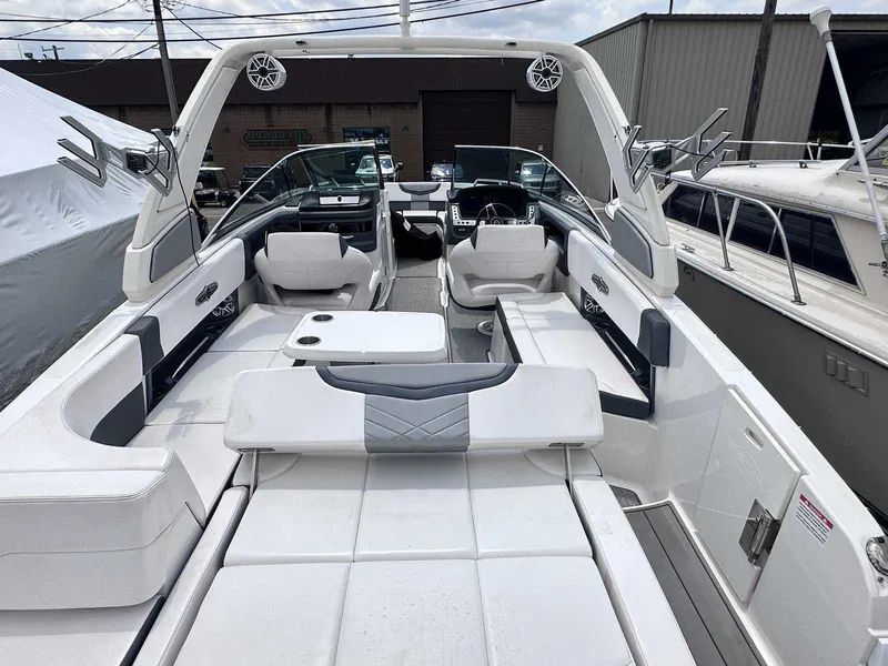 Slide: The Image of 2021 Chaparral 30 Surf boat interior with white seating and modern design. - 10