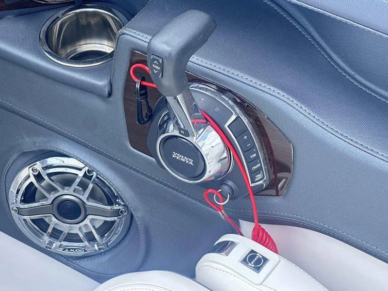 Slide: The Image of Throttle control and speaker on 2021 Chaparral 30 Surf boat interior. - 27
