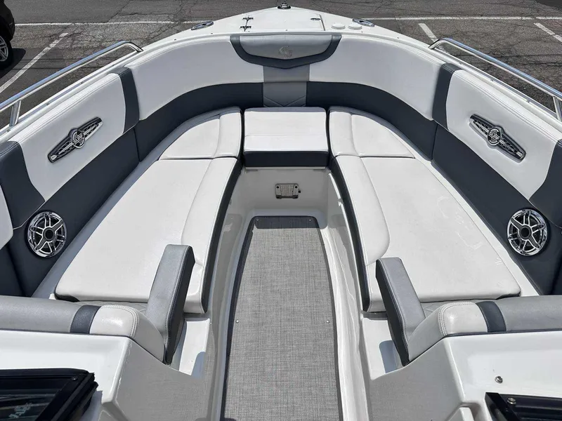 Slide: The Image of 2021 Chaparral 30 Surf boat interior with white and gray seating, modern design. - 34