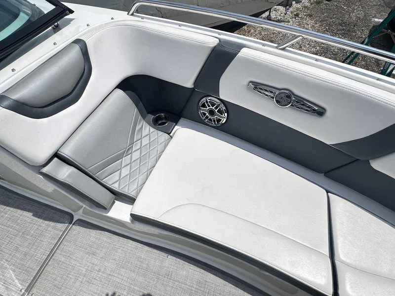 Slide: The Image of 2021 Chaparral 30 Surf boat interior with cushioned seating and speaker detail. - 36