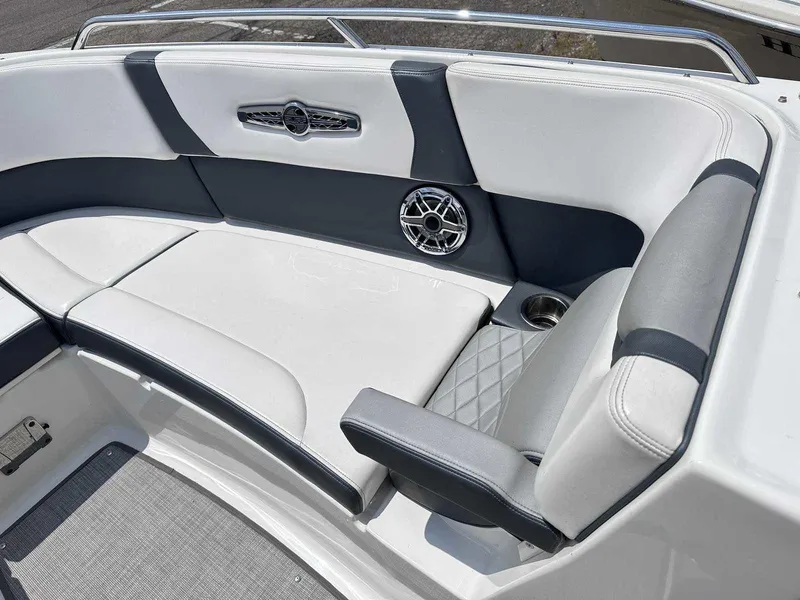 Slide: The Image of 2021 Chaparral 30 Surf boat interior with cushioned seating and speaker. - 38