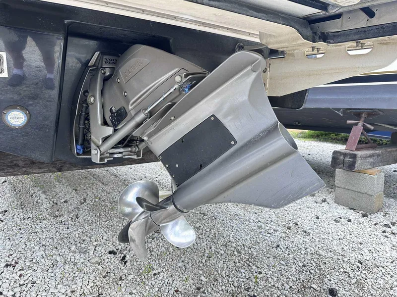 Slide: The Image of 2021 Chaparral 30 Surf boat propeller and drive system on gravel surface. - 5