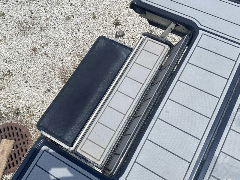 Slide: The Image of 2021 Chaparral 30 Surf boat deck with seating and storage compartments. - 8