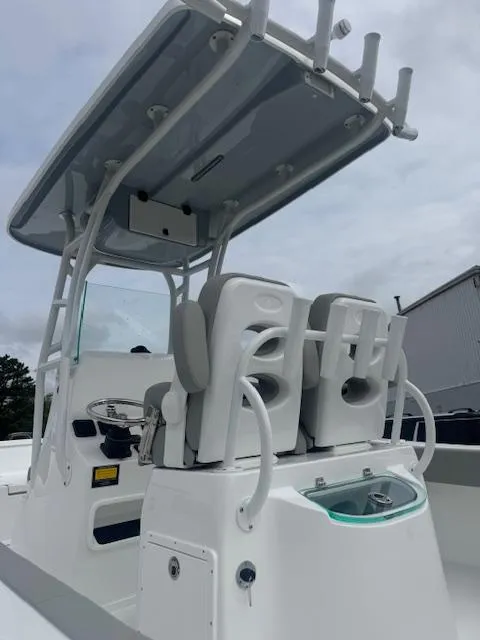 Slide: The Image of 2025 Cape Horn 22 OS boat with dual seats and T-top under cloudy sky. - 14