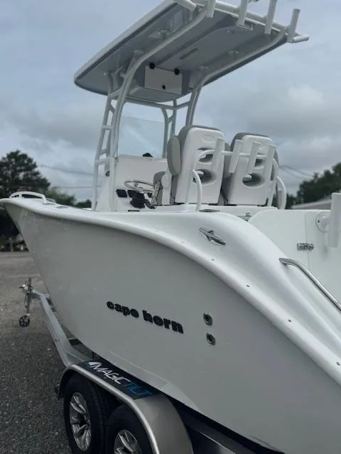 Slide: The Image of 2025 Cape Horn 22 OS boat on trailer, featuring sleek design and modern seating. - 12