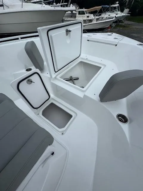 Slide: The Image of 2025 Cape Horn 22 OS boat interior with open storage compartments and seating. - 20