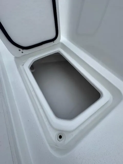 Slide: The Image of 2025 Cape Horn 22 OS boat storage compartment with open hatch. - 21