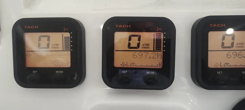 Slide: The Image of Tachometer display on 2012 Intrepid 400 Cuddy boat showing engine RPM readings. - 18