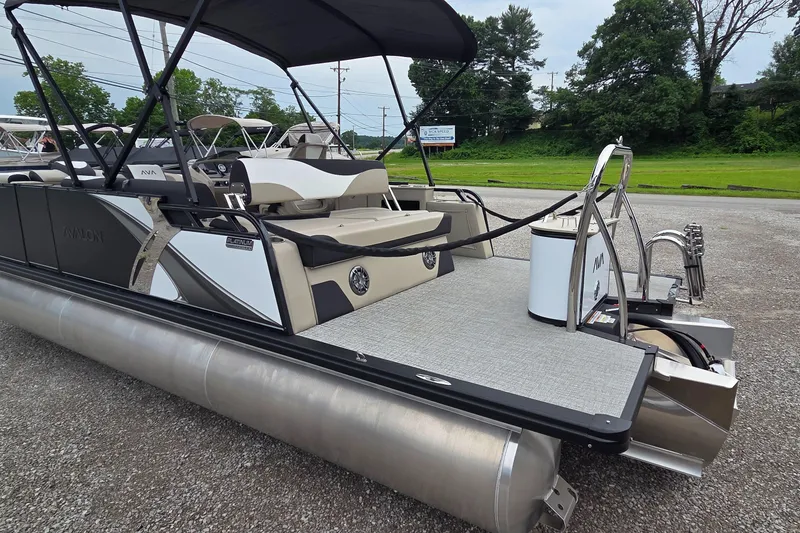 Slide: The Image of 2025 Avalon Platinum LSZ 2385 Cruise Rear Bench pontoon boat with sleek design and spacious seating. - 11