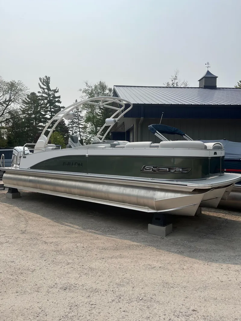 Slide: The Image of 2025 Avalon 2585 Catalina Quad Lounger Shift pontoon boat on display outdoors. - 3