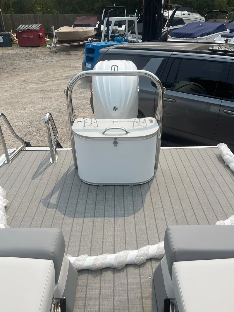 Slide: The Image of 2025 Avalon 2585 Catalina Quad Lounger Shift boat interior with seating and storage. - 8