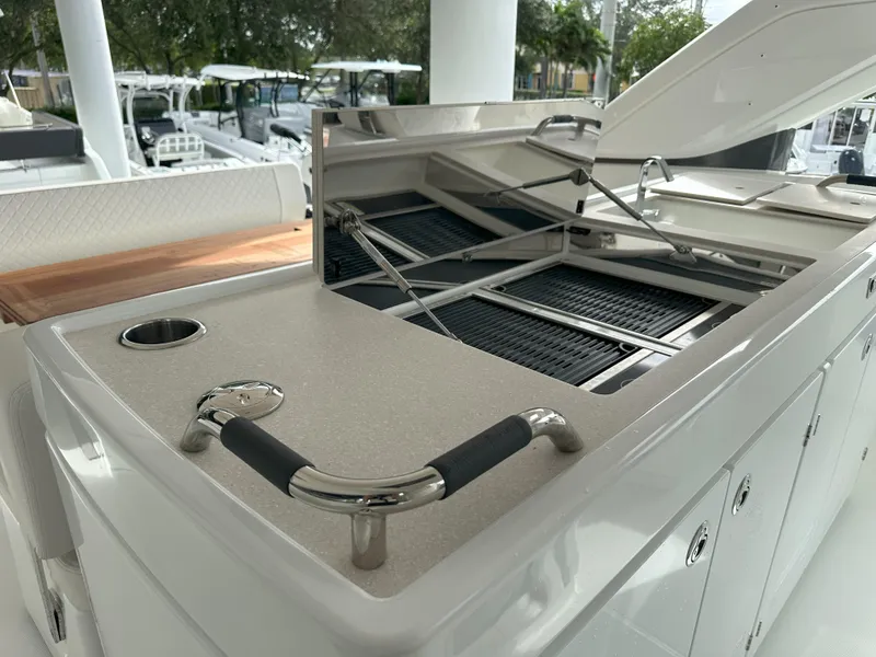 Slide: The Image of Outdoor kitchen area on 2024 Jeanneau DB 43 yacht with grill and storage. - 17
