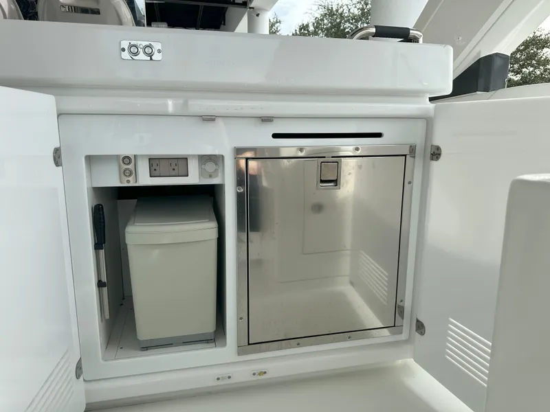 Slide: The Image of 2024 Jeanneau DB 43 yacht interior with built-in storage and stainless steel appliances. - 19