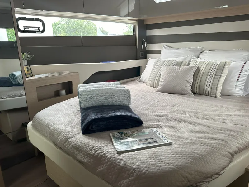 Slide: The Image of Luxurious interior of 2024 Jeanneau DB 43 yacht with cozy bed and modern decor. - 30