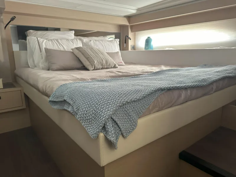 Slide: The Image of Luxurious bedroom interior of 2024 Jeanneau DB 43 yacht with cozy bedding and modern design. - 38