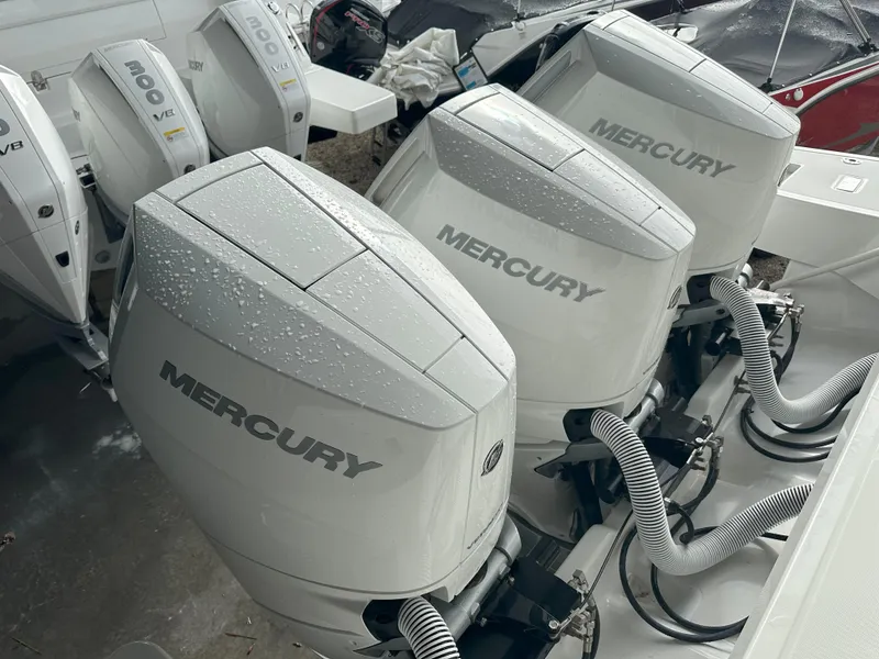 Slide: The Image of Triple Mercury outboard engines on a 2024 Jeanneau DB 43 boat, showcasing power and performance. - 6