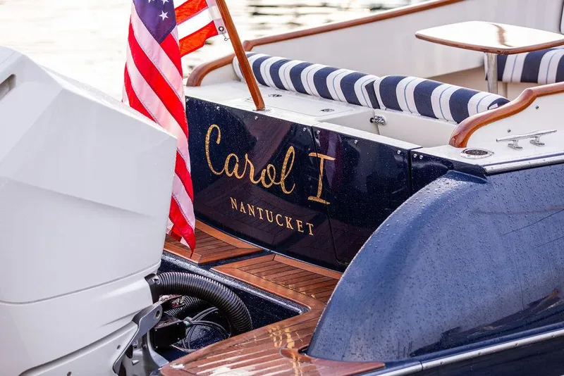 Slide: The Image of 2024 Hinckley 35 boat cruising on calm water, certified pre-owned. - 10