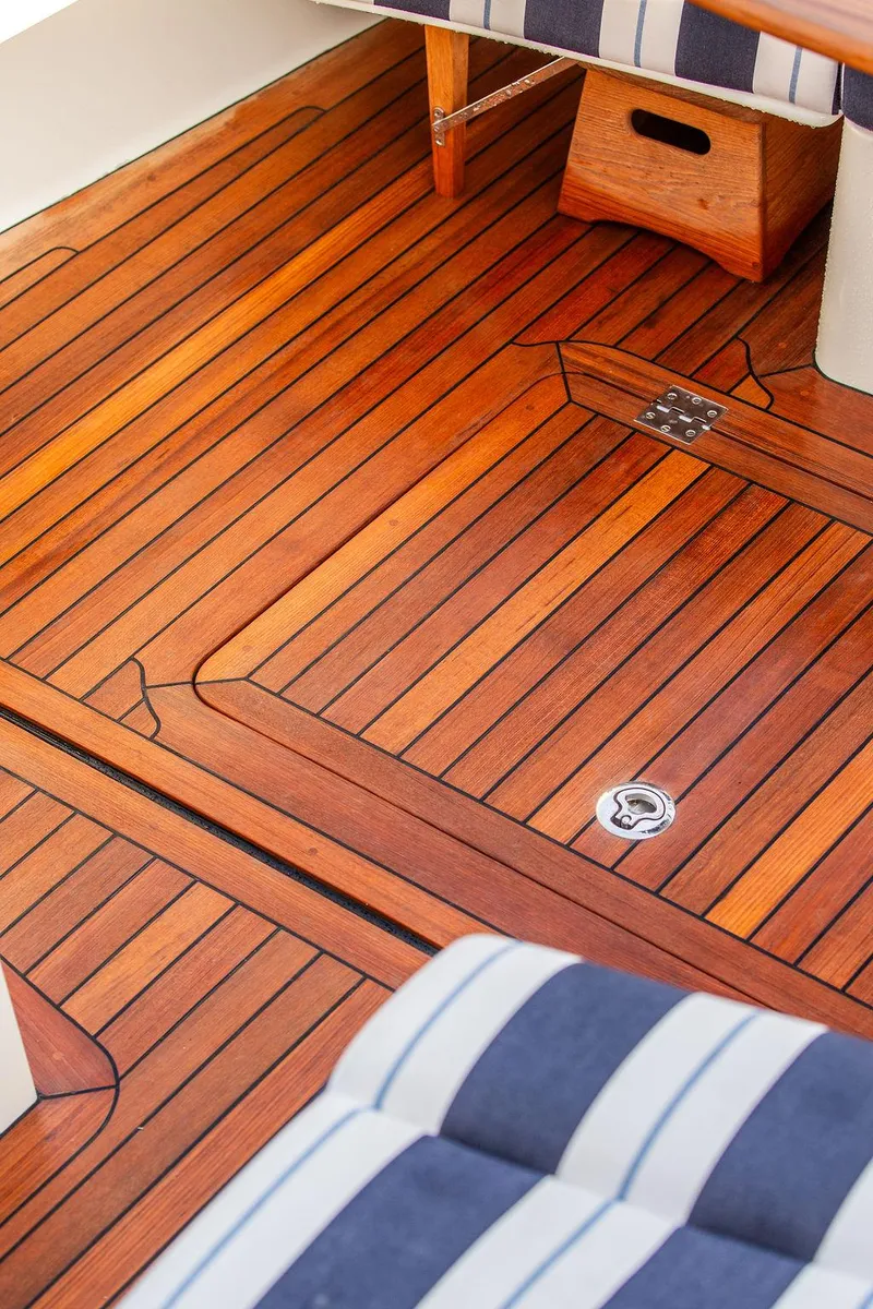 Slide: The Image of 2024 Hinckley 35 yacht bathroom with wooden cabinetry and modern fixtures. - 13