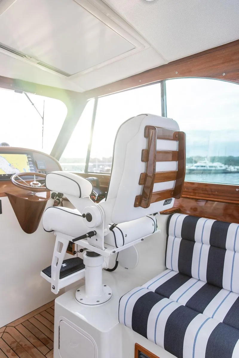 Slide: The Image of Joystick control on a 2024 Hinckley 35 boat, featuring sleek design and illuminated interface. - 20