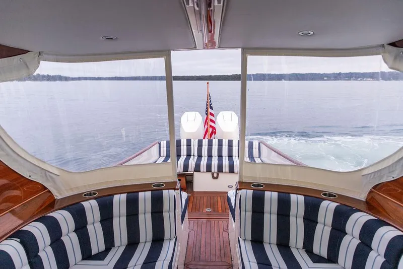 Slide: The Image of Interior of 2024 Hinckley 35 yacht, featuring wooden flooring and cabinetry. - 39
