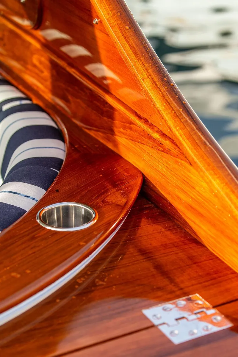 Slide: The Image of 2024 Hinckley 35 interior with polished wooden flooring and steps. - 40